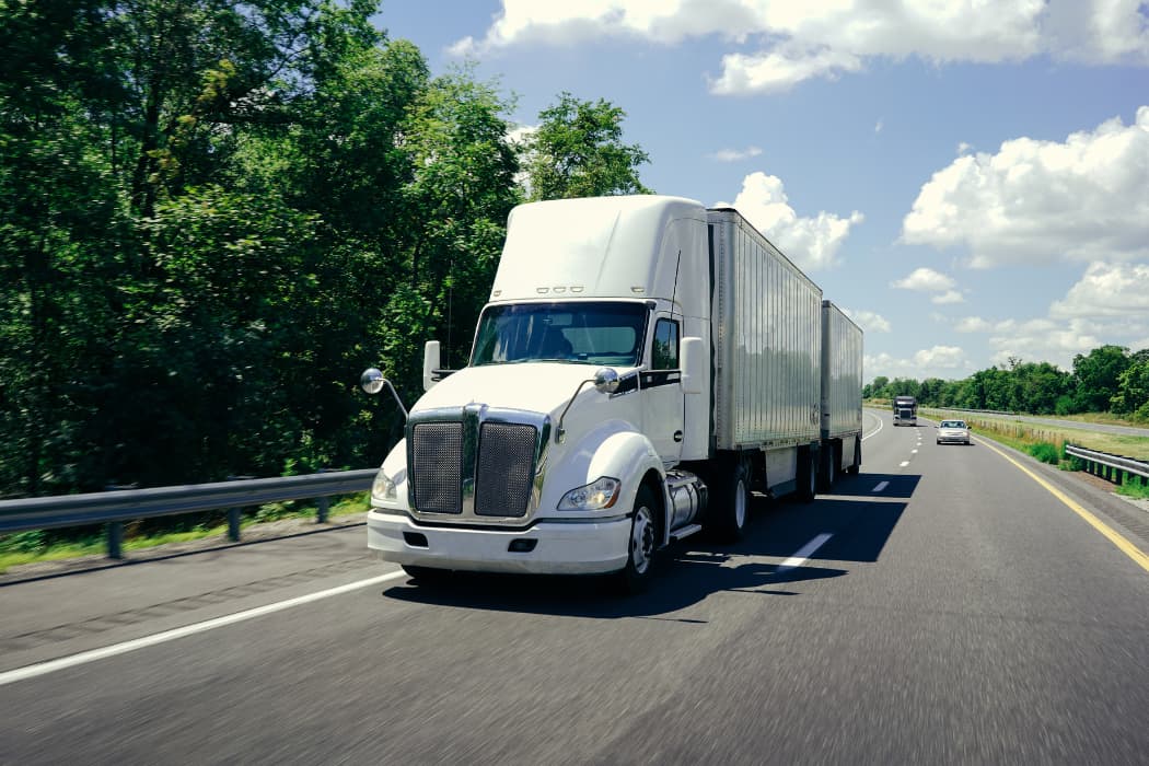 LTL Trucking: Front view of less than truckload shipping truck on freeway